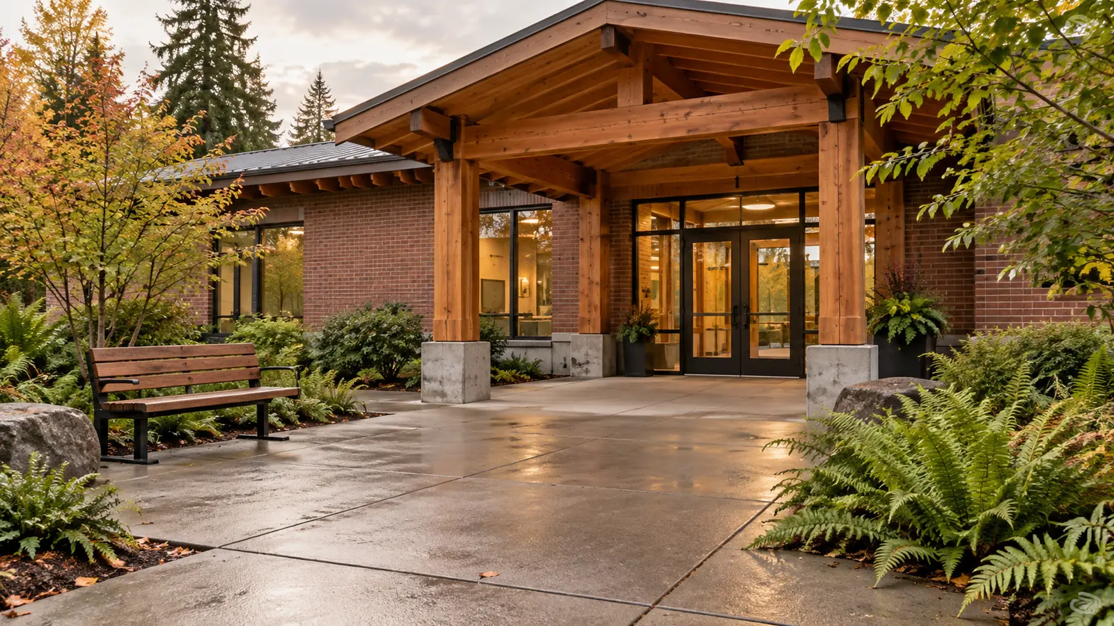 Illustrated covered community entrance with an open courtyard, bench and unobstructed walkway.